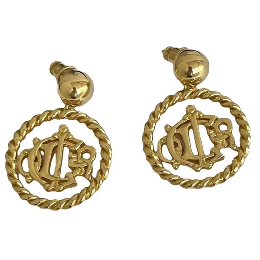 Gold-toned earrings with vintage circular designs of Christian Dior
