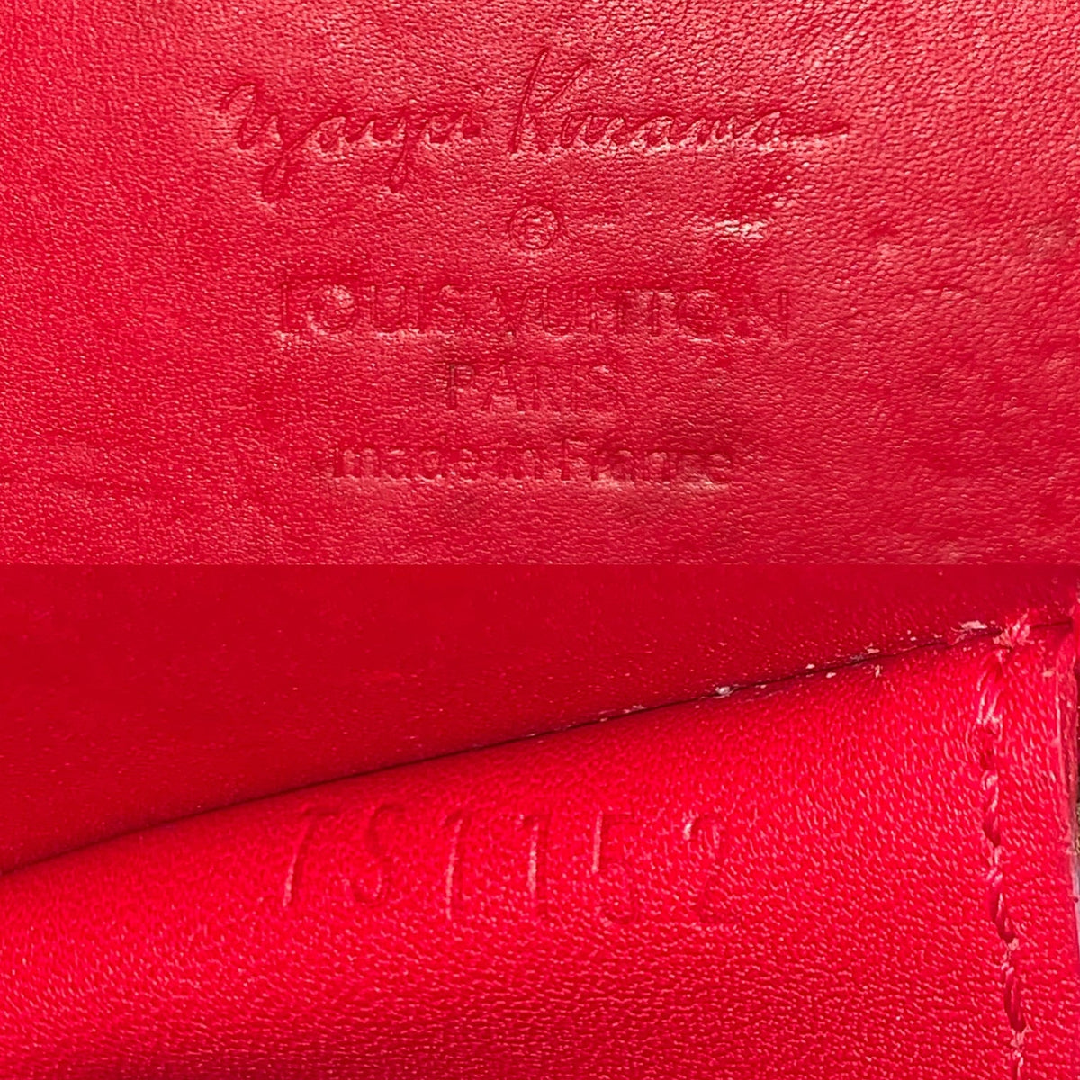 Date code of Louis Vuitton x Yayoi Kusama Porto Monnaie Chapeau Vernis Wallet Coin Purse is located inside top edge.